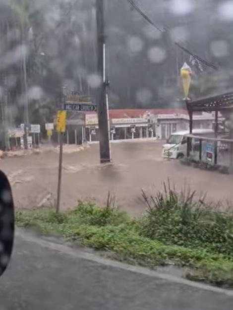 Cars and shops in floodwaters at Mt Tamborine (VIDEO ABOVE).