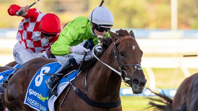 Reserve Bank, ridden by Jamie Melham, wins The Goodwood at Morphettville on Saturday. Picture: Makoto Kaneko