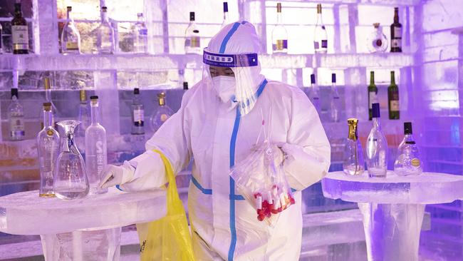 A medical officer wearing protective clothing conducts Covid-19 tests during an ice and snow art festival in Wuhan in December, 2021. Picture: Getty Images