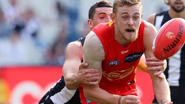 AFL Round 7. 01/05/2021. Collingwood vs Gold Coast Suns at the MCG, Melbourne. Hugh Greenwood of the Suns clears by hand . Pic: Michael Klein