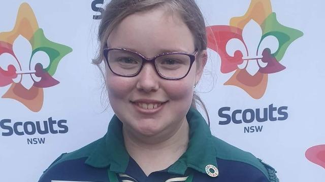 Jacinta showing off a Scouts award