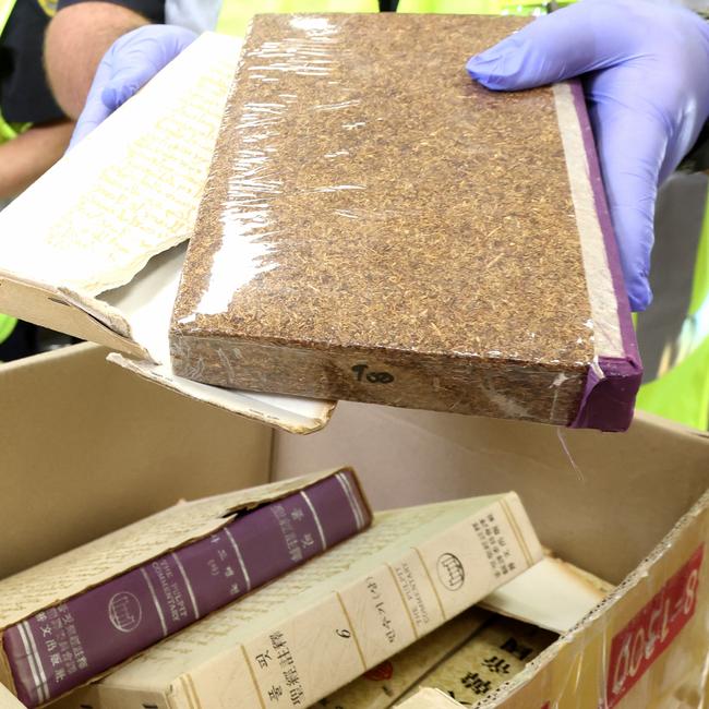 Suspected packages of tobacco disguised as books. Picture: Steve Pohlner