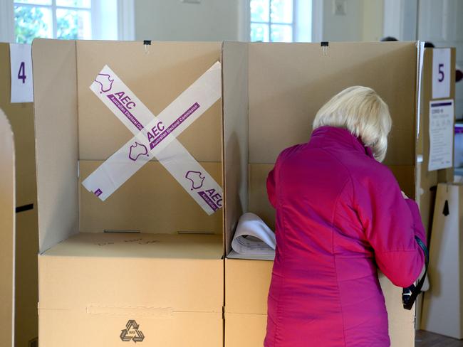MELBOURNE, AUSTRALIA - NewsWire Photos MAY 21, 2022: People cast their vote at a polling booth at St Peter's and St Paul's in South Melbourne. Picture: NCA NewsWire / Andrew Henshaw