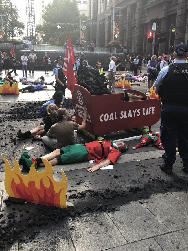 Extinction Rebellion protestors dumping coal in the middle of Sydney's CBD whilst simultaneously staging a die-in. Picture: Twitter