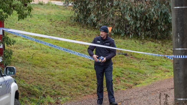 Police tape off street near where the body was discovered. Picture: Jason Edwards