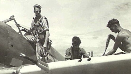 Lyall Ellers climbs into the cockpit of his plane. Picture: Australian War Memorial