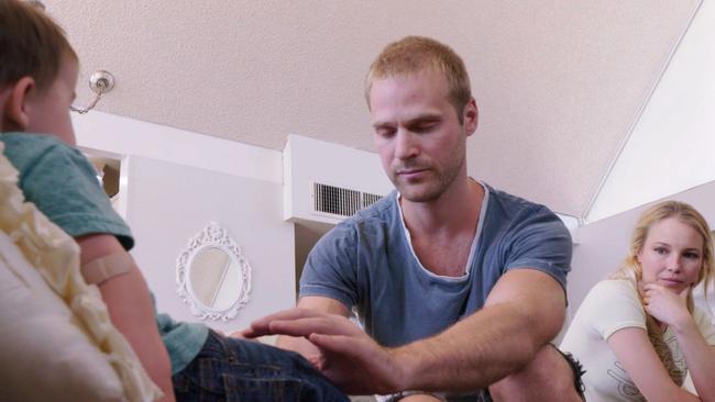 Charlie works on Gibson Barkdull. The little boy has been in pain since birth. Picture: Foxtel/TLC