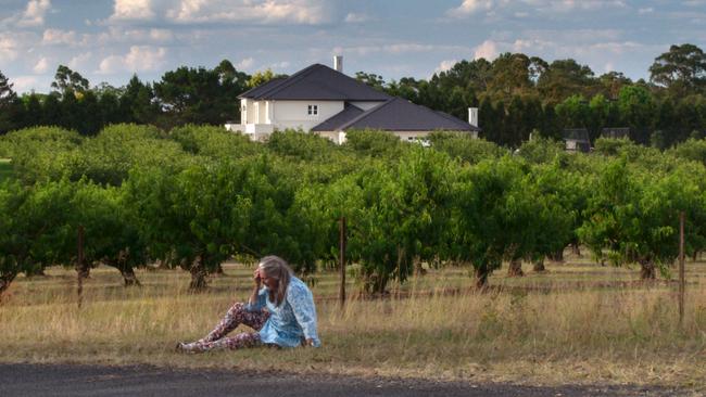 A still from ‘A Stitch in Time,’ with the lead sitting on a road near Sasha’s childhood home in Dural