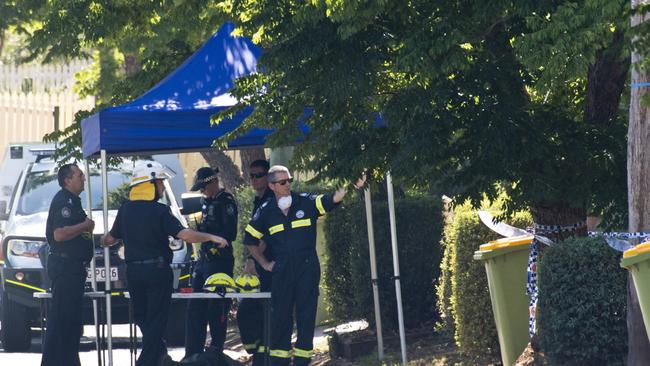 Police and fire investigators at a South Toowoomba crime scene following a house fire in Rivett St, Monday, December 16, 2019. Picture: Kevin Farmer