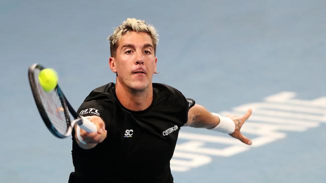 Thanasi Kokkinakis chases a wide one. Picture: Sarah Reed/Getty Images