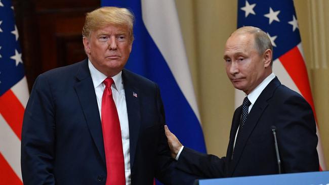 (FILES) US President Donald Trump (L) and Russia's President Vladimir Putin leave at the end of a joint press conference after a meeting at the Presidential Palace in Helsinki, on July 16, 2018. US President-elect Donald Trump suggested November 7, 2024 that he would likely speak with Russia's President Vladimir Putin, NBC News reported, after the Republican was swept to victory in the US presidential election. (Photo by Yuri KADOBNOV / AFP)