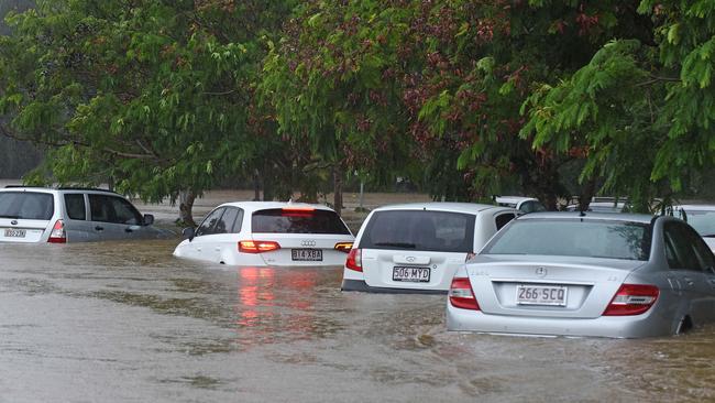 Cars in Robina were swamped by floodwaters during a deluge.