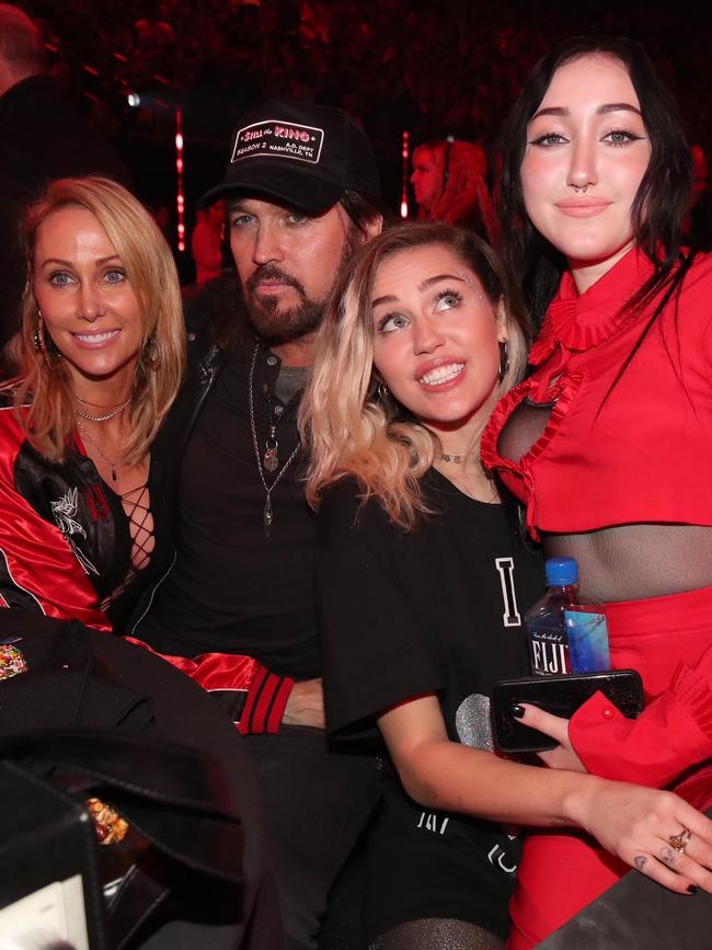 Tish Cyrus, and singers-songwriters Billy Ray Cyrus, Miley Cyrus, and Noah Cyrus pose during the 2017 iHeartRadio Music Awards. Picture: Christopher Polk/Getty Images