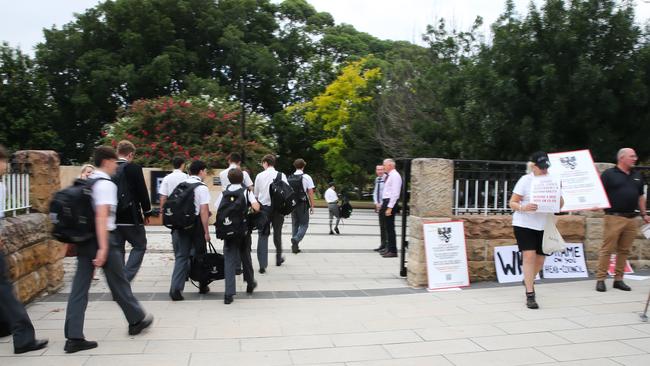 Parents are seen campaigning against Newington College's controversial decision to go co-ed at the prestigious secondary school on the first day of the 2024 academic year today in Stanmore, Sydney. Picture: Gaye Gerard