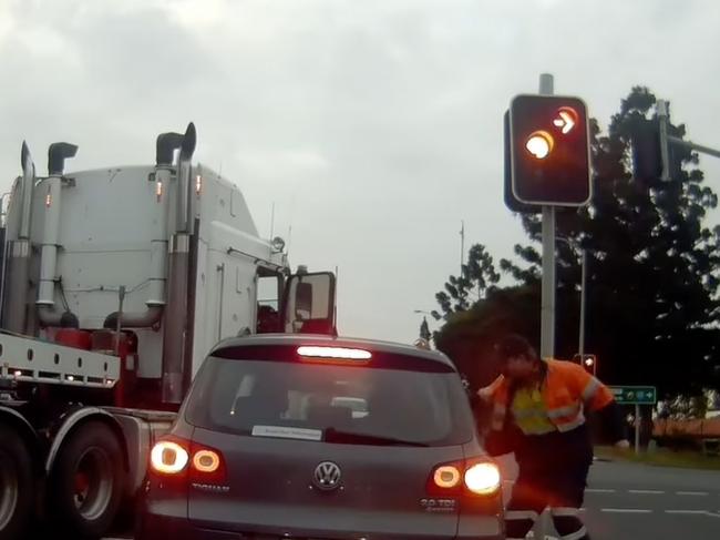 The truckie appeared to punch the driver through their open window. Picture: Dash Cam Owners Australia