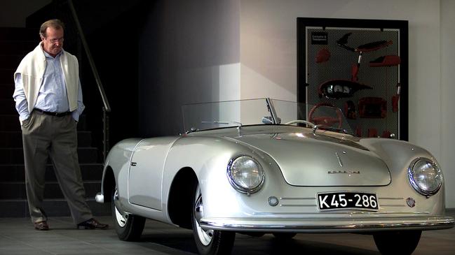 A customer inspects the first ever Porsche sportscar made in 1948, at the new Porsche dealership showroom at Alexandria in Sydney. 