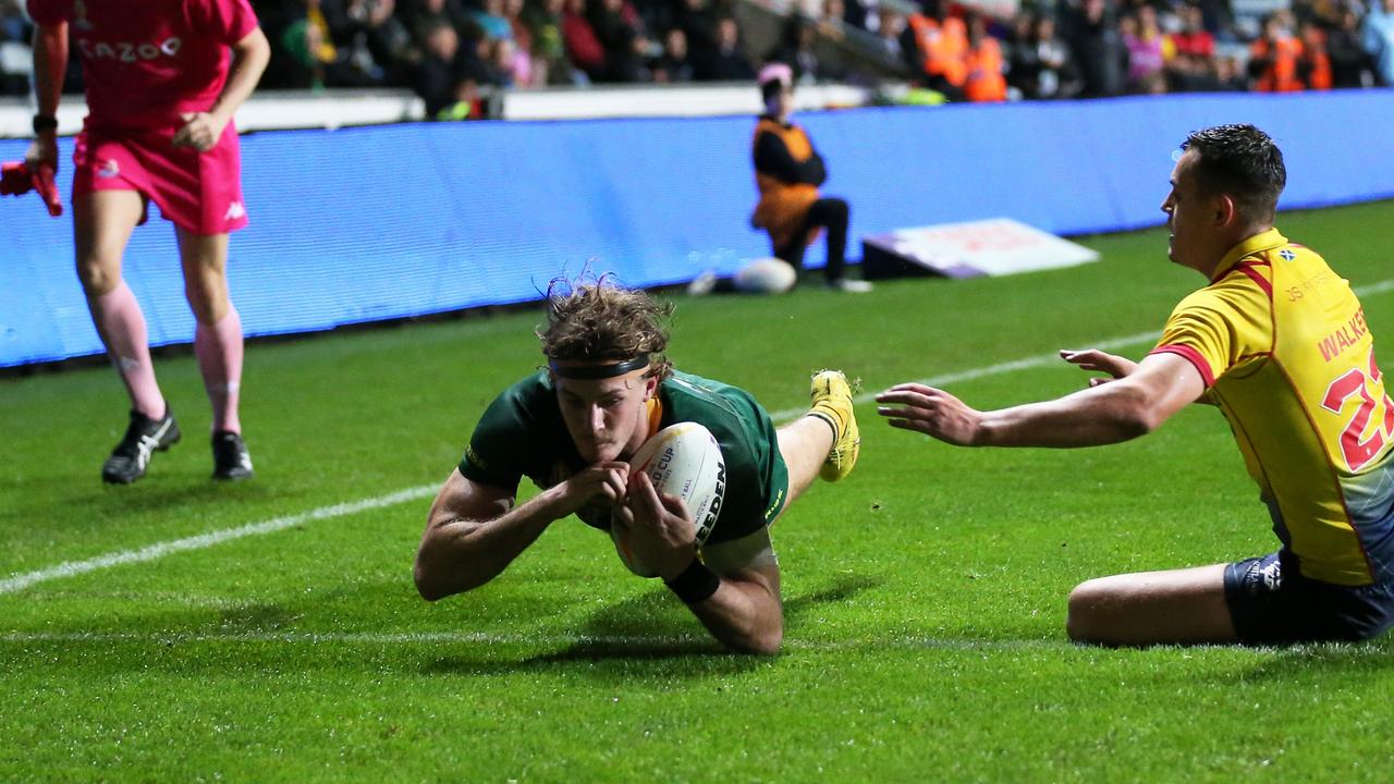 COVENTRY, ENGLAND - OCTOBER 21: Campbell Graham of Australia goes over for their hat trick try and their sides thirteenth try during the Rugby League World Cup 2021 Pool B match between Australia and Scotland at The Coventry Building Society Arena on October 21, 2022 in Coventry, England. (Photo by Alex Livesey/Getty Images for RLWC)