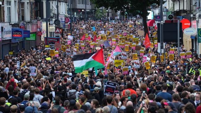 A Palestinian flag is waved as anti-racism counter protesters gathered ahead of a potential anti-immigration protest on August 7, 2024 in Walthamstow, United Kingdom. A series of anti-immigrant protests and riots have swept the country in the week after a deadly knife attack in Southport, England, fuelled by false rumours that the suspect was an asylum seeker. Picture: Carl Court/Getty Images