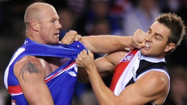 St Kilda’s Sam Fisher cops a hit from Western Bulldogs’ Barry Hall during a clash in 2010. Picture: AAP