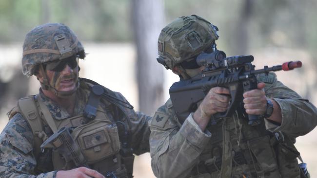 US Marines in conjunction with Australian soldiers from Battle Group Eagle comprising of elements of 3rd Brigade conduct an urban clearance of a fictitious invading force at the Townsville Filed Training Area. US Marines in connection with M1 A1 Abrams tanks from 2nd Calvary Regiment began an urban clearance at the Urban Operations Training Facility. Picture: Evan Morgan