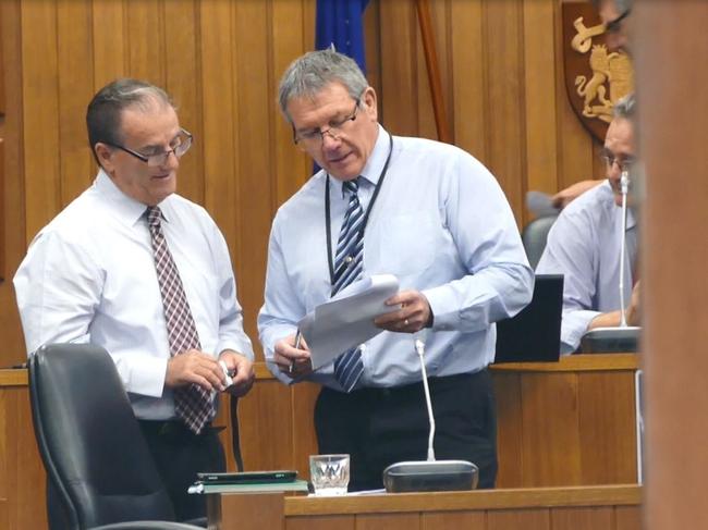 Clarence Valley Council mayor Jim Simmons and  director corporate Ashley Lindsay discuss the agenda before a council meeting.