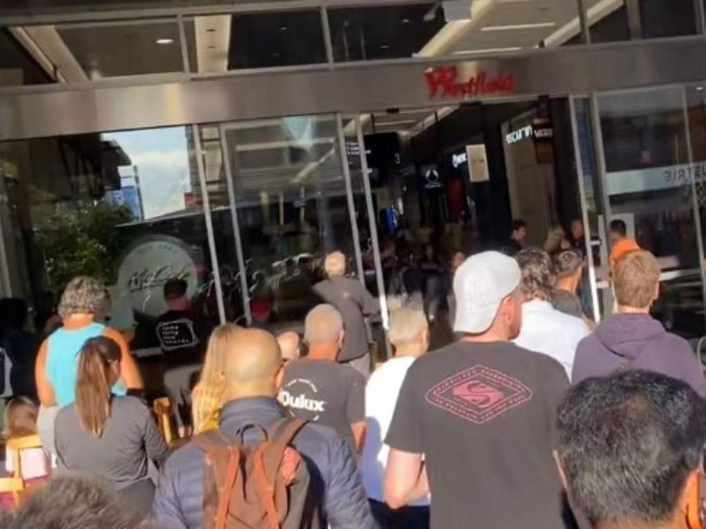 Terrified shoppers outside the centre after being evacuated.