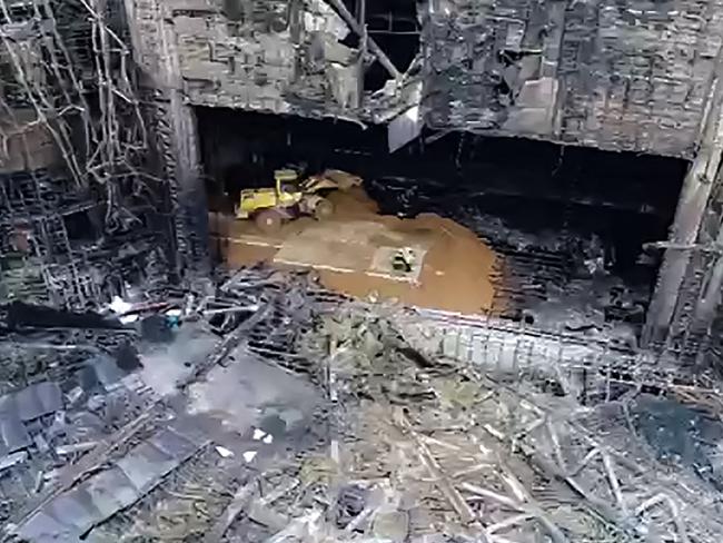 Emergency services personnel clearing the rubble of the burnt-out Crocus City Hall concert venue in Krasnogorsk, outside Moscow. Picture: RUSSIAN EMERGENCY MINISTRY / AFP