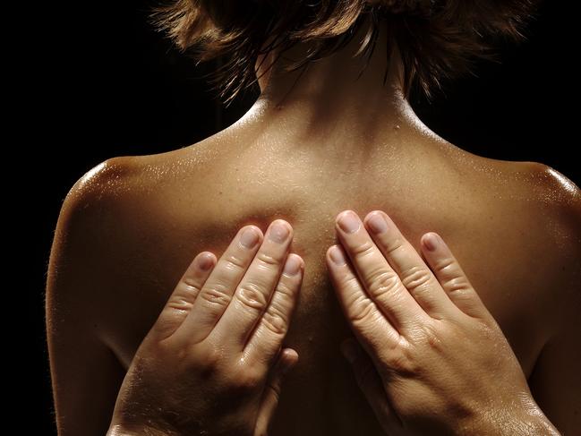 Massage pics - generic. Hands on a woman's back.