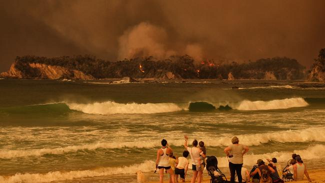 Bushfire arrives into the township of Malua Bay. Picture: Alex Coppel.