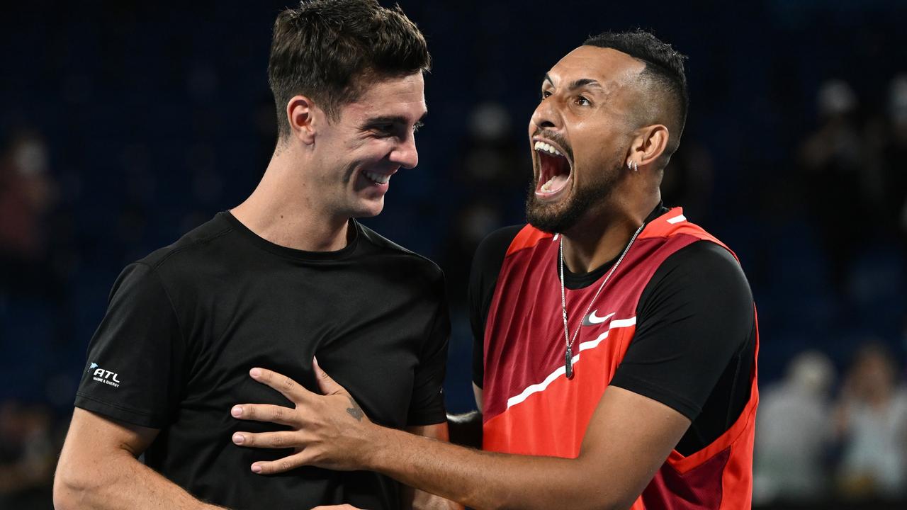 Thanasi Kokkinakis and Nick Kyrgios celebrate their slam title. Photo by Quinn Rooney/Getty Images.