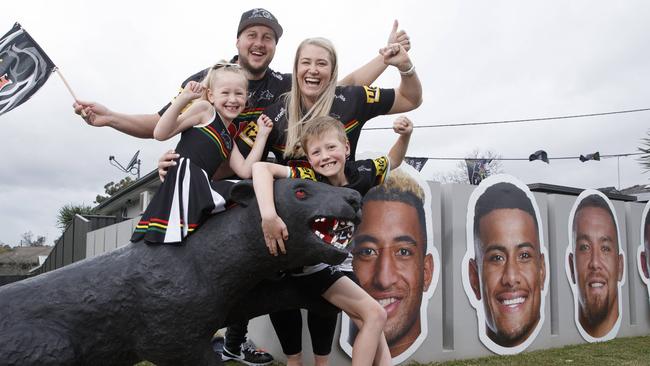 The Christie family in front of just some of their Panthers display.