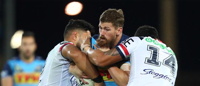 GOLD COAST, AUSTRALIA - JULY 15: Will Matthews of the Titans is tackled during the round 18 NRL match between the Gold Coast Titans and the Sydney Roosters at Cbus Super Stadium on July 15, 2018 in Gold Coast, Australia. Picture: Chris Hyde/Getty Images.