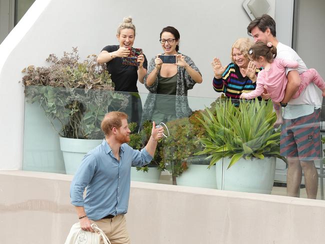 Prince Harry charms residents watching the event from their apartment in Bondi. Picture: Brett Costello