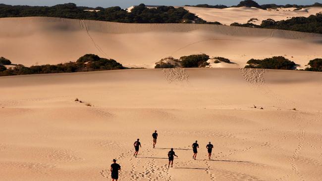 Port Adelaide players in 2006, about to tackle Little Sahara during the training camp at Kangaroo Island.