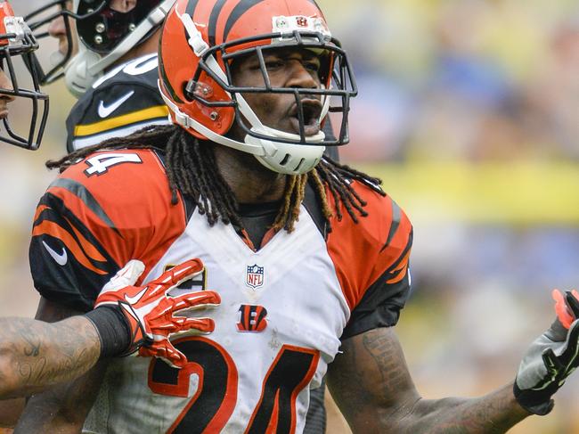 FILE - In this Sept. 18, 2016, file photo, Cincinnati Bengals cornerback Adam Jones (24) is restrained by teammate, (31) during an NFL football game against the Pittsburgh Steelers, in Pittsburgh. The last time the Steelers came to town, they knocked the Bengals out of the playoffs with a stunning last-minute rally. Theyâ€™re headed back this way with a chance to inflict another loss that will leave a lasting mark. (AP Photo/Doug Kapustin, File)