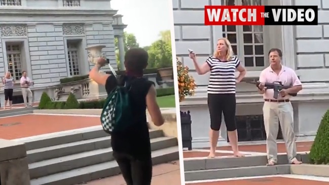 Video of wild scenes as couple draw guns on protesters outside their palatial mansion