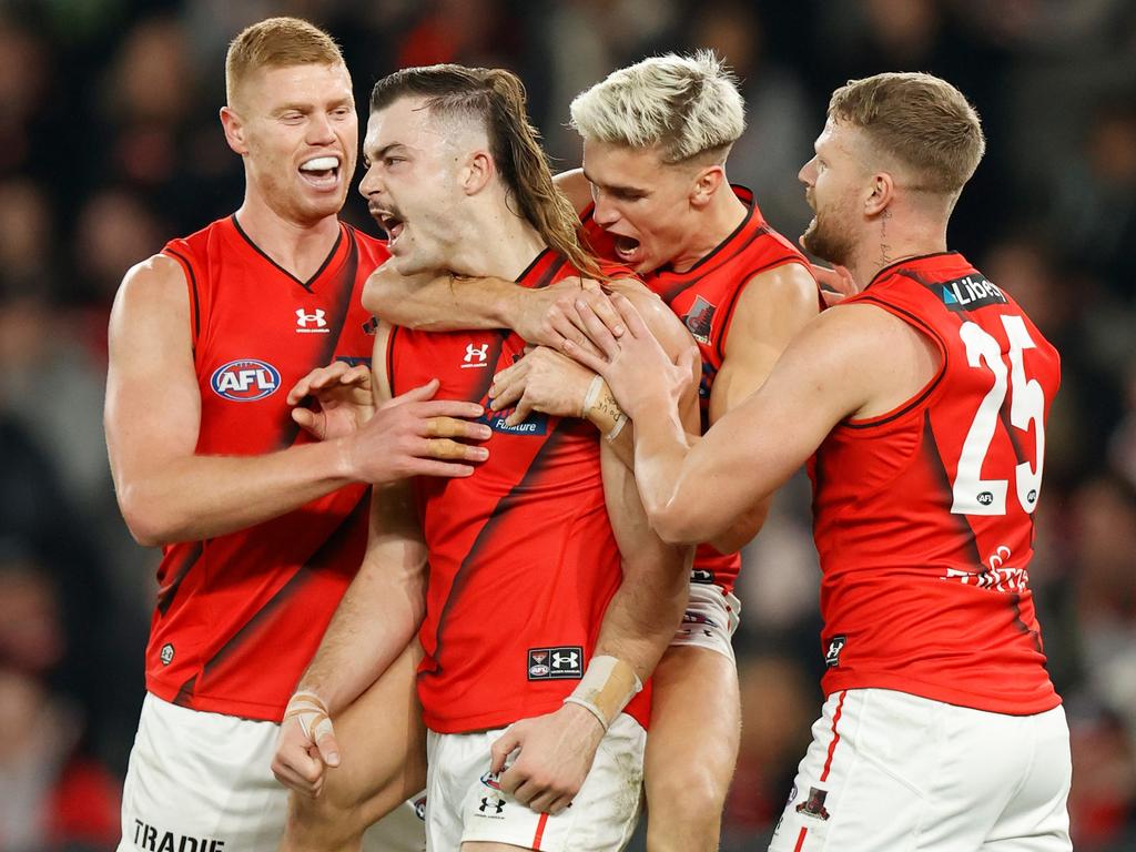 Peter Wright, Sam Draper, Matt Guelfi and Jake Stringer celebrate a goal. Picture: AFL Photos/Getty Images