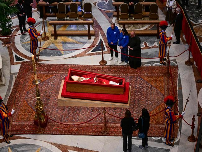 The body of Pope Francis lies in state inside St. Peterâs Basilica in The Vatican, on April 23, 2025. The Pope died of a stroke, the Vatican announced hours after the death on April 21, 2025, of the 88-year-old reformer who inspired devotion but riled traditionalists during 12 years leading the Catholic Church. (Photo by Tiziana FABI / AFP)