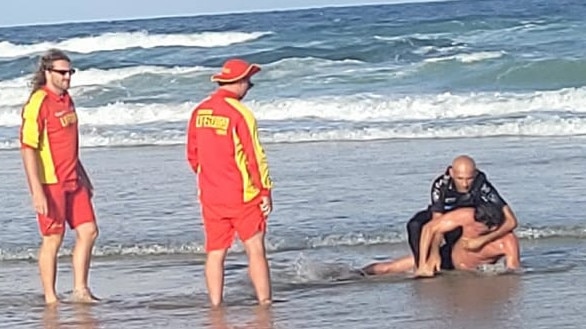 A dramatic arrest has taken place on a packed Coolum Beach, on the Sunshine Coast, on January 11. Picture: Tony O'Brien