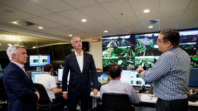 NSW Roads minister John Graham and Transport traffic operations directors Craig Moran (left) and Chris Zito (right) during a visit to the Transport Management Centre to discuss the Rozelle Interchange at AM peak. Picture: NCA NewsWire / Nikki Short