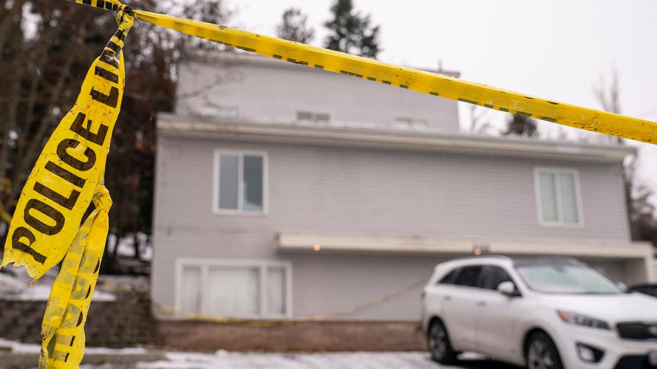 Police tape is seen at a home that is the site of a quadruple murder. Picture: David Ryder/Getty Images North America/Getty Images via AFP