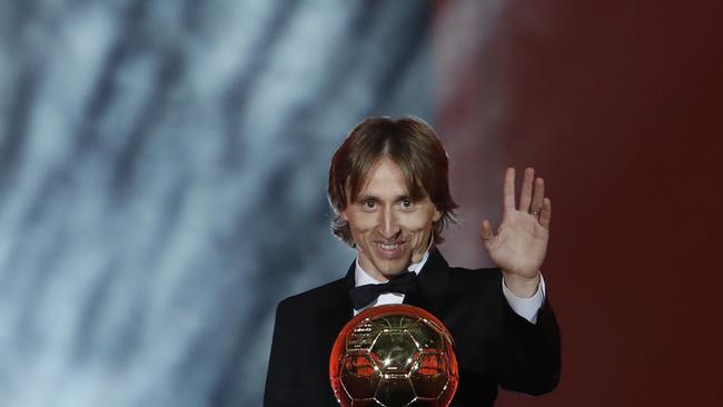 Real Madrid's Luka Modric celebrates with the Ballon d'Or award