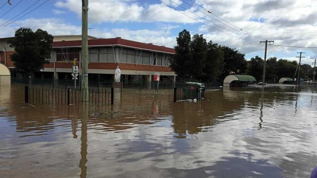 Testing of the grounds at Trinity Catholic College found soil contamination hotspots after the flood.