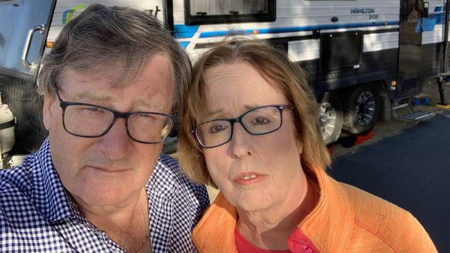 John, 66, and Jacquie, 64, Seymour-Griffin outside the caravan were they have been locked down for over five weeks. Picture: Supplied