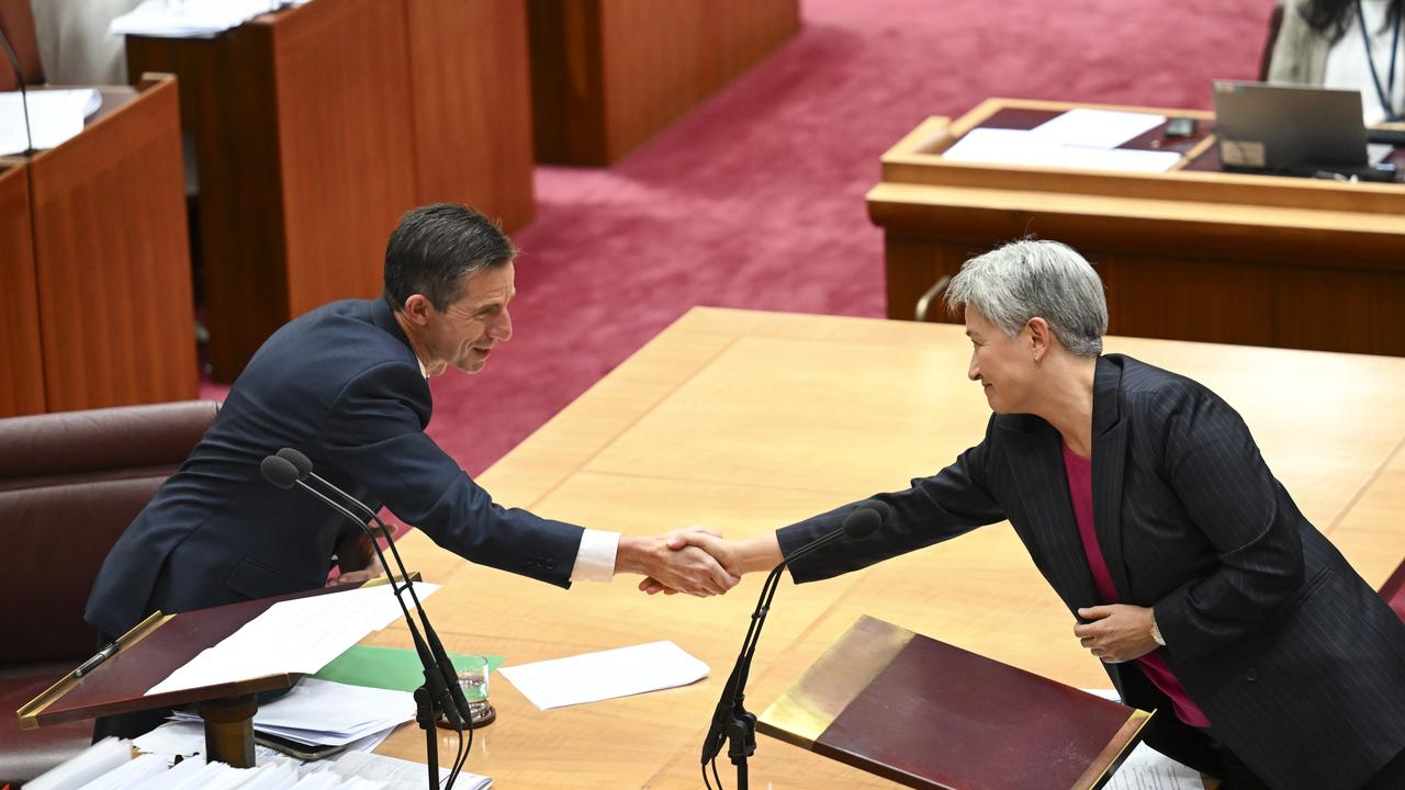 Senator Penny Wong congratulates Senator Simon Birmingham after his valedictory speech in the Senate at Parliament House in Canberra on November 28, 2024. Picture: NewsWire / Martin Ollman