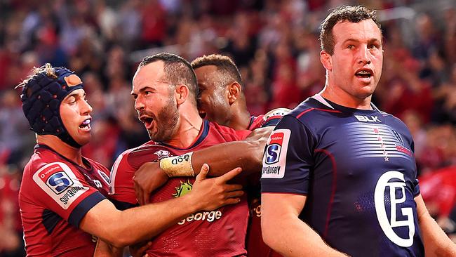 Jono Lance celebrates scoring for the Reds on Friday night.