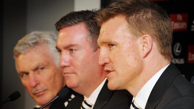 McGuire as Collingwood president with Mick Malthouse and Nathan Buckley. Picture: Craig Borrow