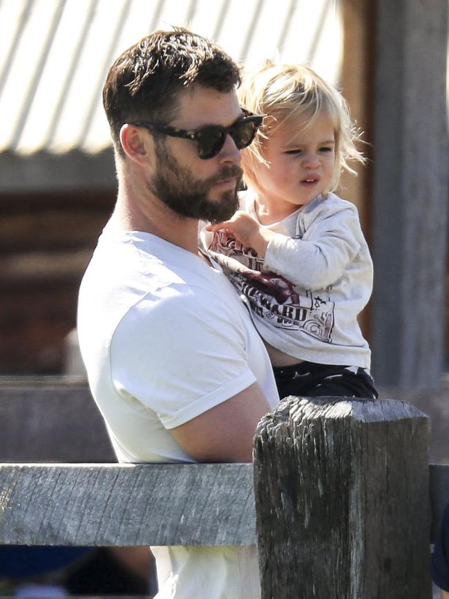 Chris lifts one of his sons to give him a better look at the animals. Picture: Media Mode