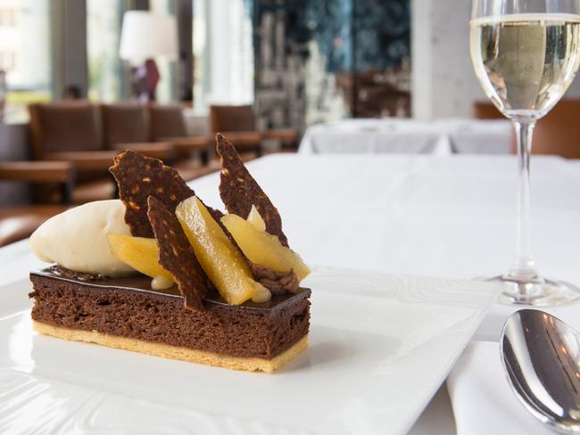 Baked chocolate mousse with caramelised pears and pear sorbet. Picture: Supplied