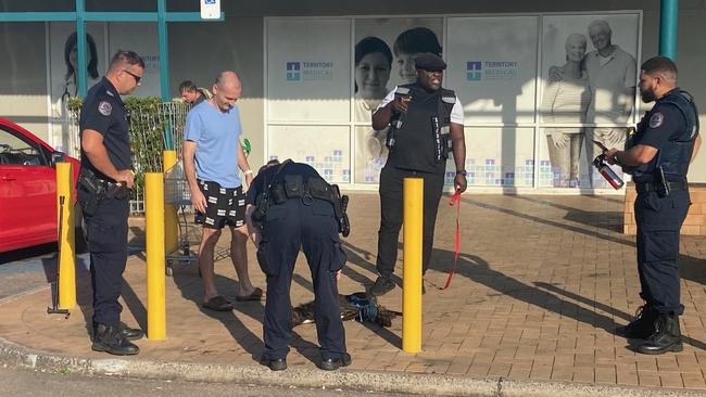 Police speak to witnesses after the Sunday morning dog attack.